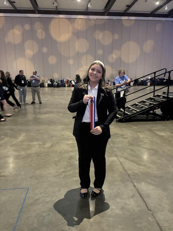 Smiling teens dressed in professional attire
