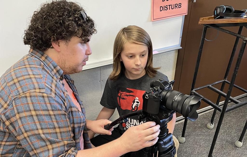 Student working on directing and filming a short film