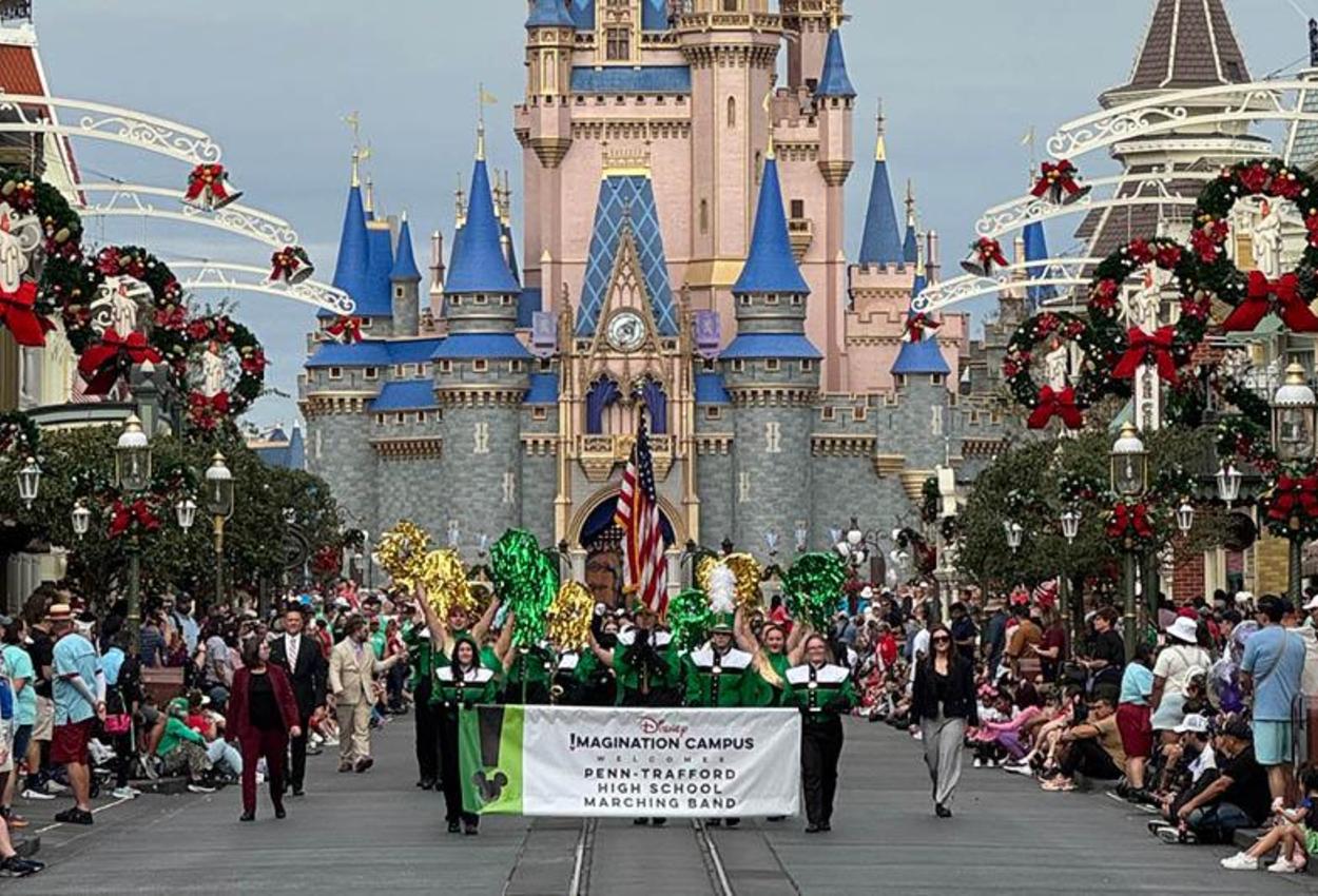 The PTHS Marching Band parades down Main Street USA at Disney World