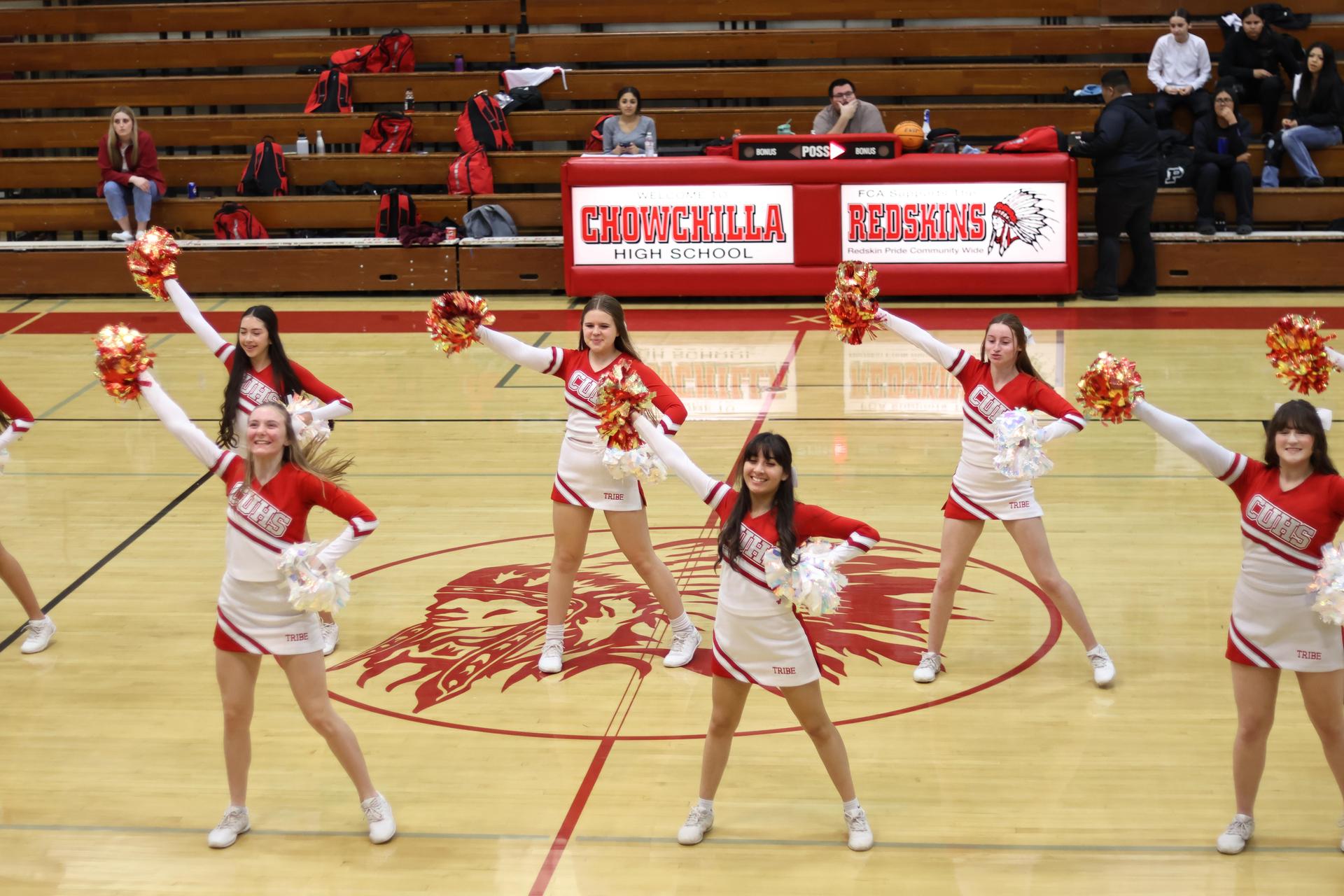 junior varsity cheerleaders cheering