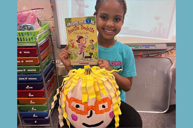 Skye Greenhowe with her book, Amelia Bedelia Tries Her Luck