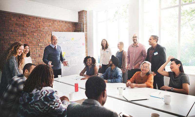 Folks sitting around table during meeting