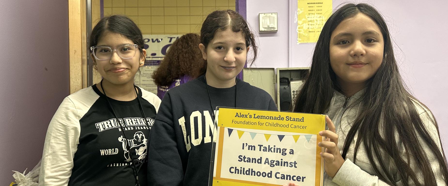 students holding sign