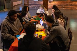 An overhead view of a table of students