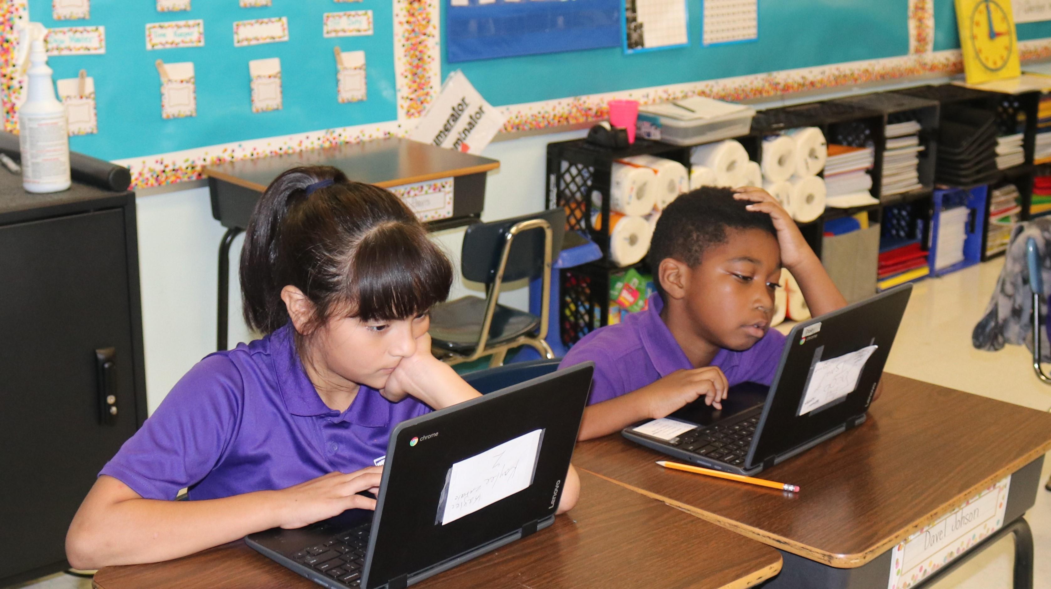 students on laptop