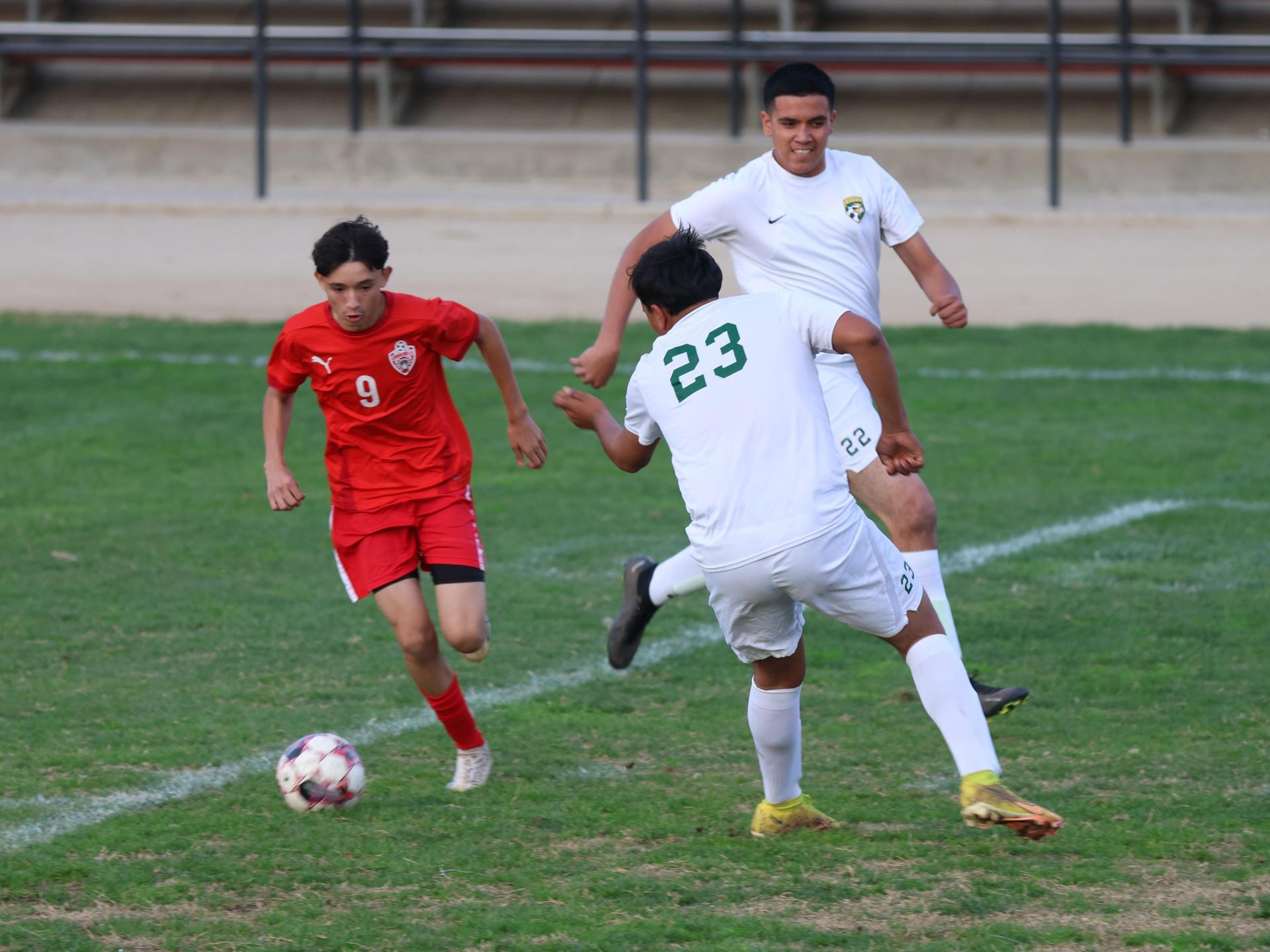 Junior Varisty boys playing soccer against Kingsburg