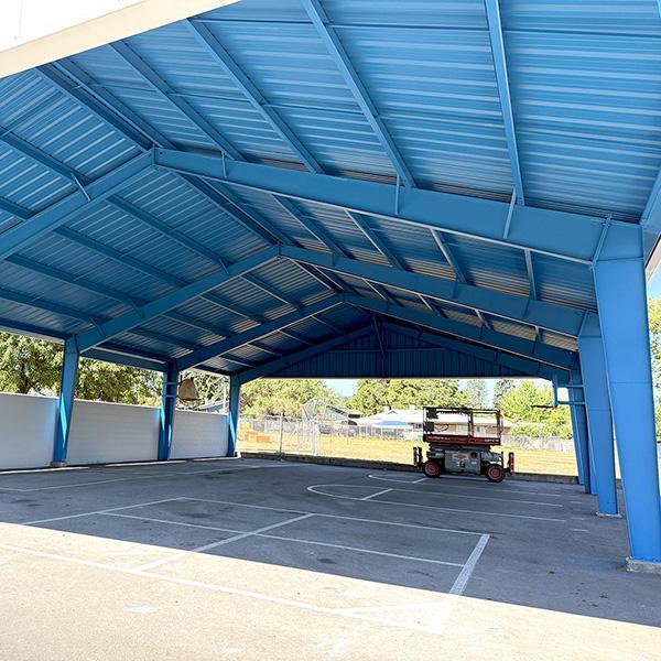 freshly-painted covered play structure