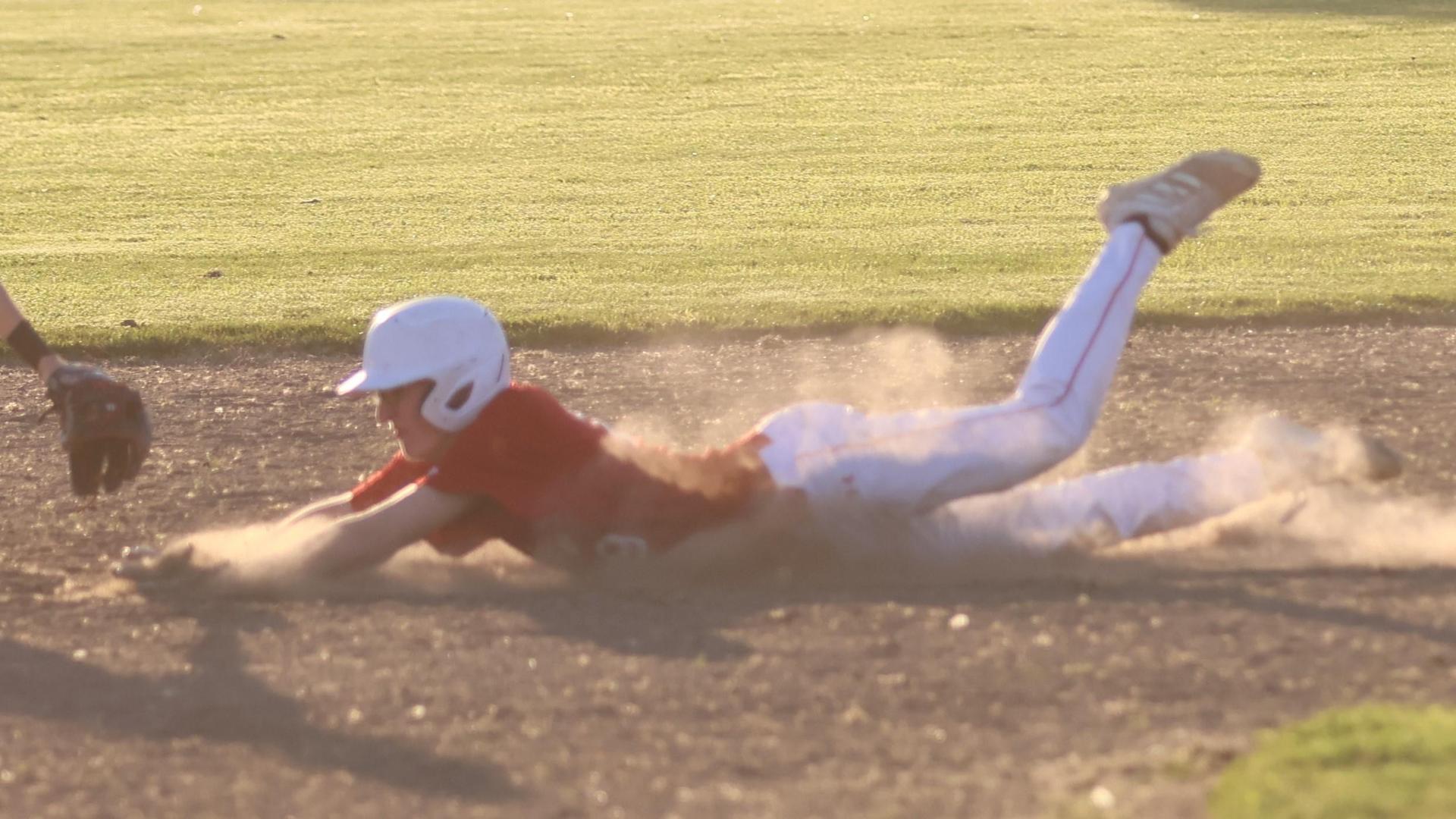 junior varsity baseball players in action