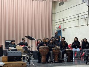 Eighth graders on the band with Dr. Joseph performing on the saxophone