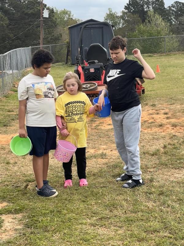 Life Skills kids hunting Easter eggs.