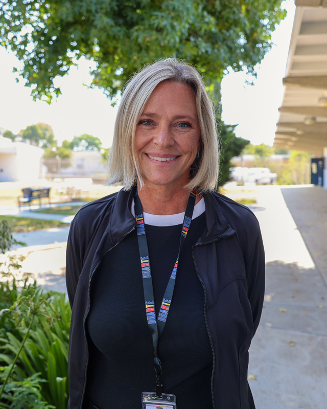 Associate Principal Shay Fairchild standing outside smiling