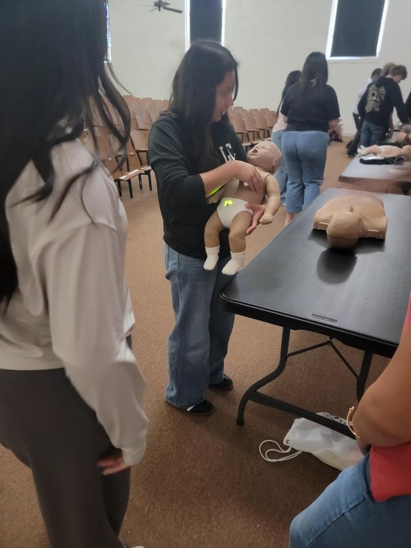 Senior students learning CPR.