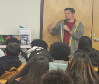 Students listening to a presentation from an author