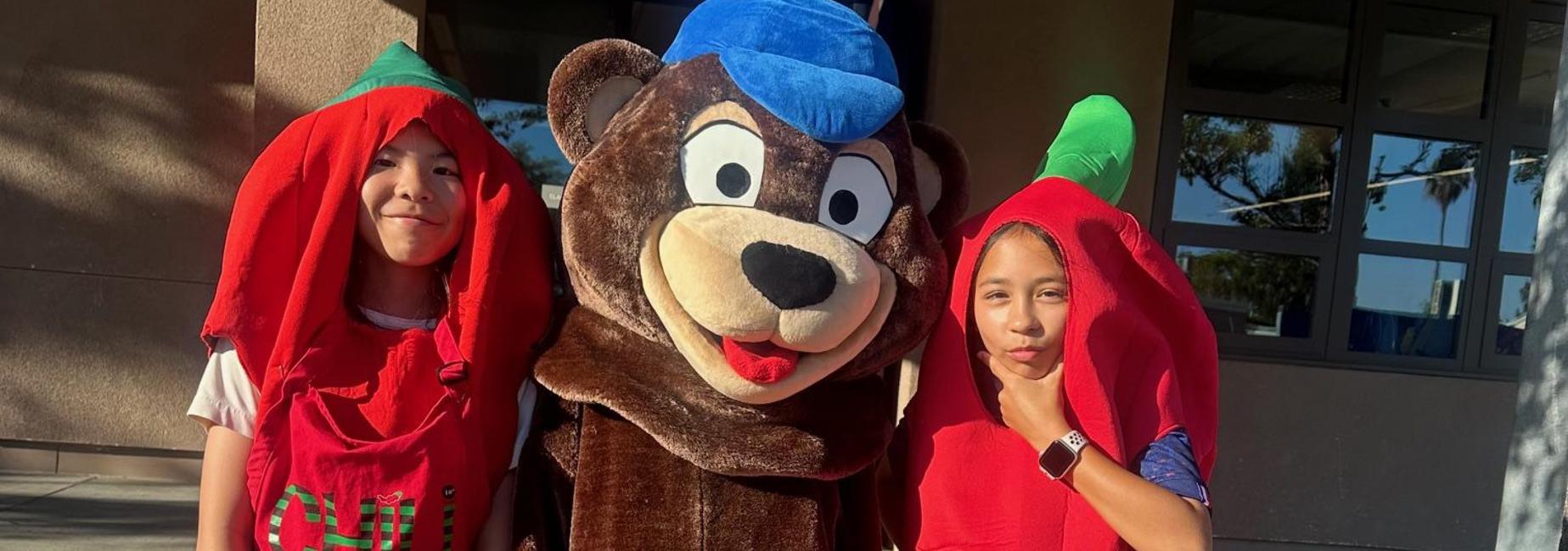 Two chili peppers and our Bear mascot