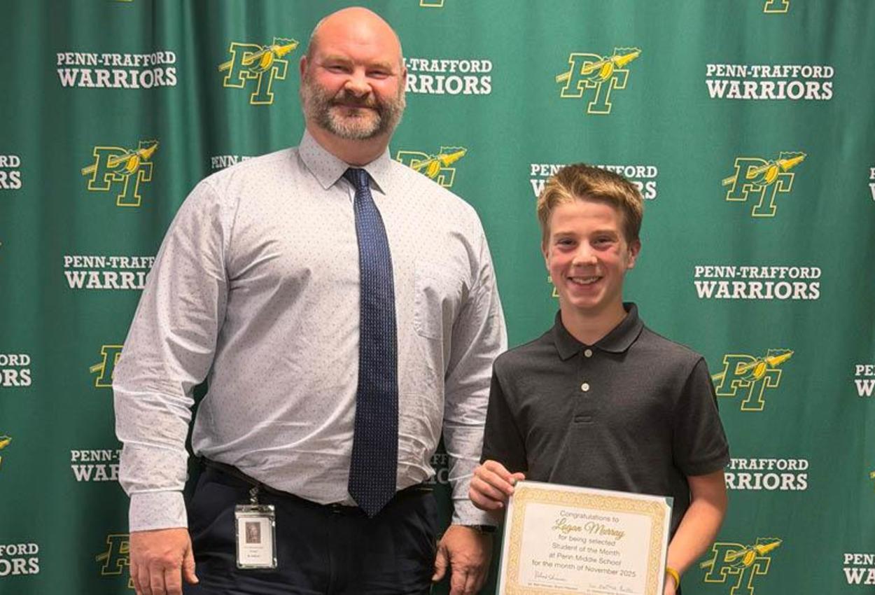 Principal Sullivan with student of the month Logan Murray