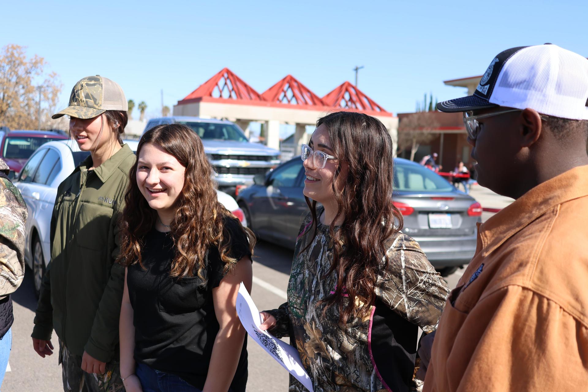 students and staff enjoying the truck pull