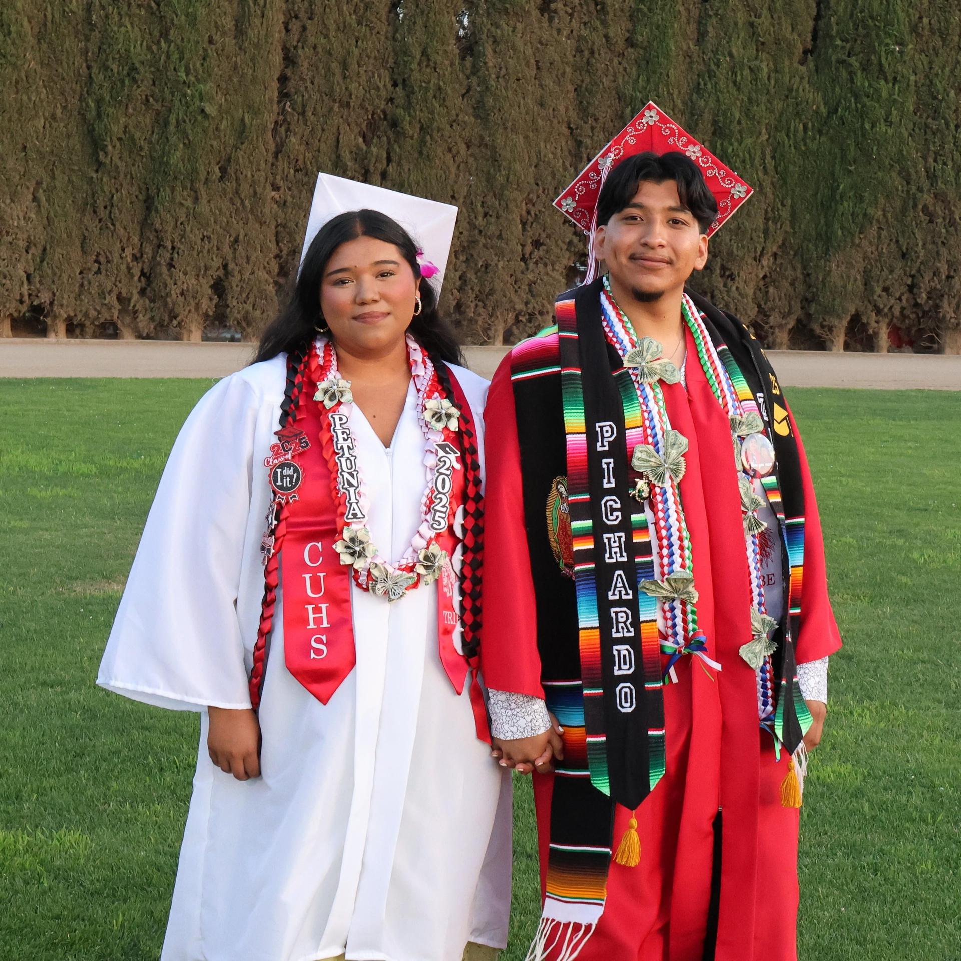 seniors posing together before walking in to graduation