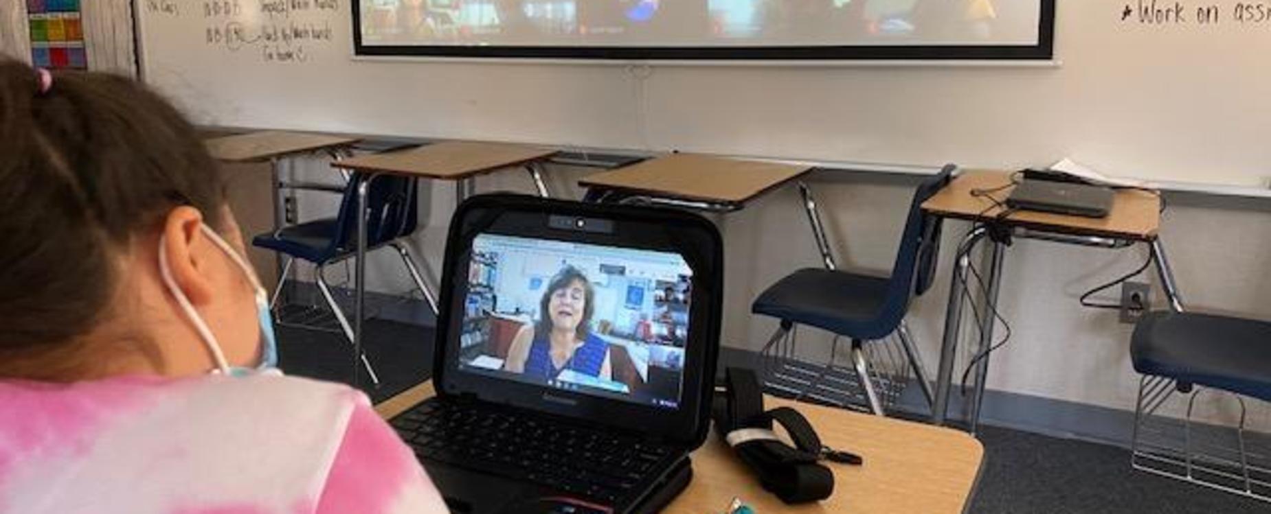 Mrs. Douglas working with a class virtually