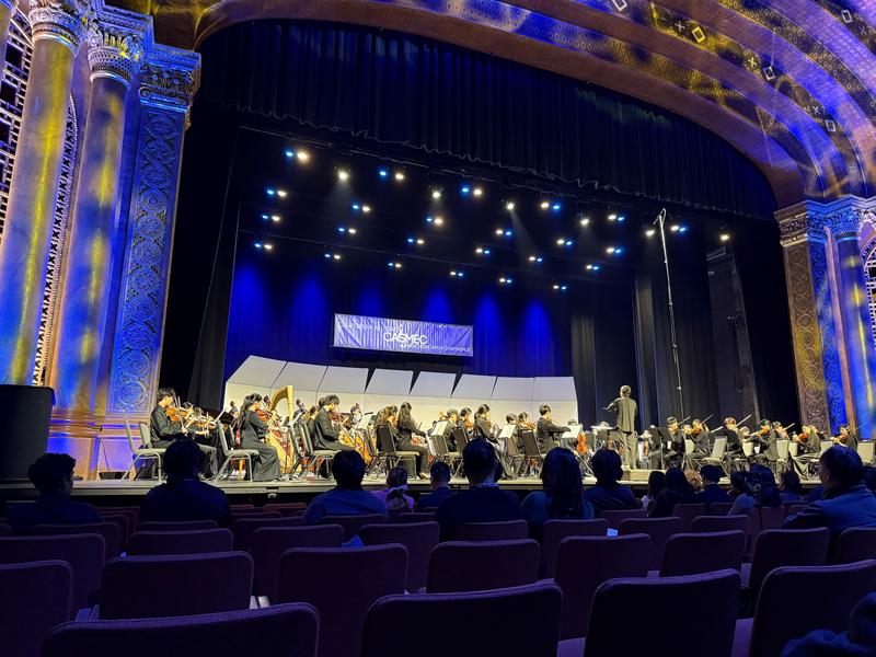 CASEMEC orchestra on stage performing