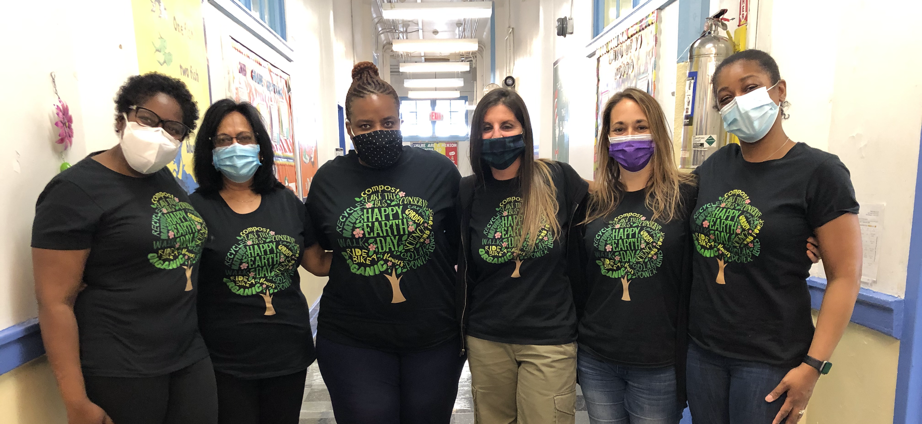 School Staff in Earth Day tee shirts.