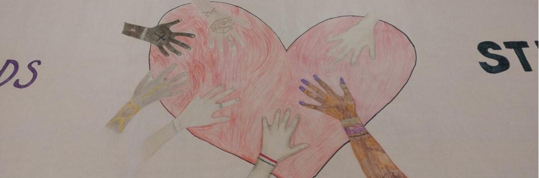 Student artwork heart with hands