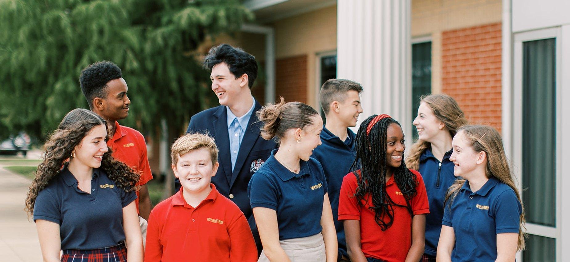 Founders Classical Academy of Corinth students laughing together outside the school