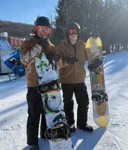 Two Students with Snowboards