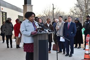 Jocelyn Speaking at podium