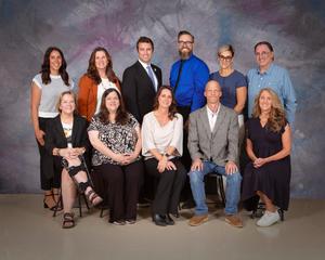 A group of teachers seated for a formal portrait