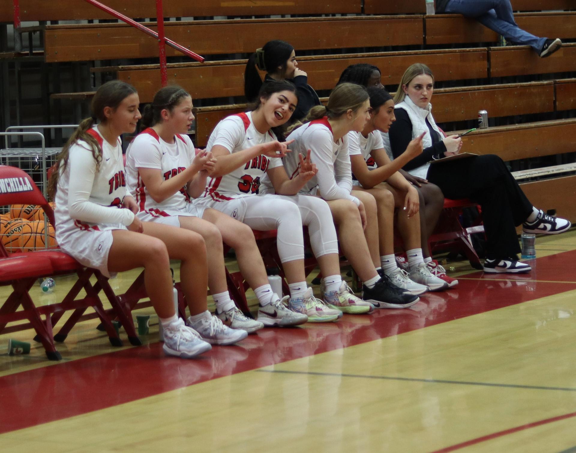 varsity girls playing basketball against mariposa