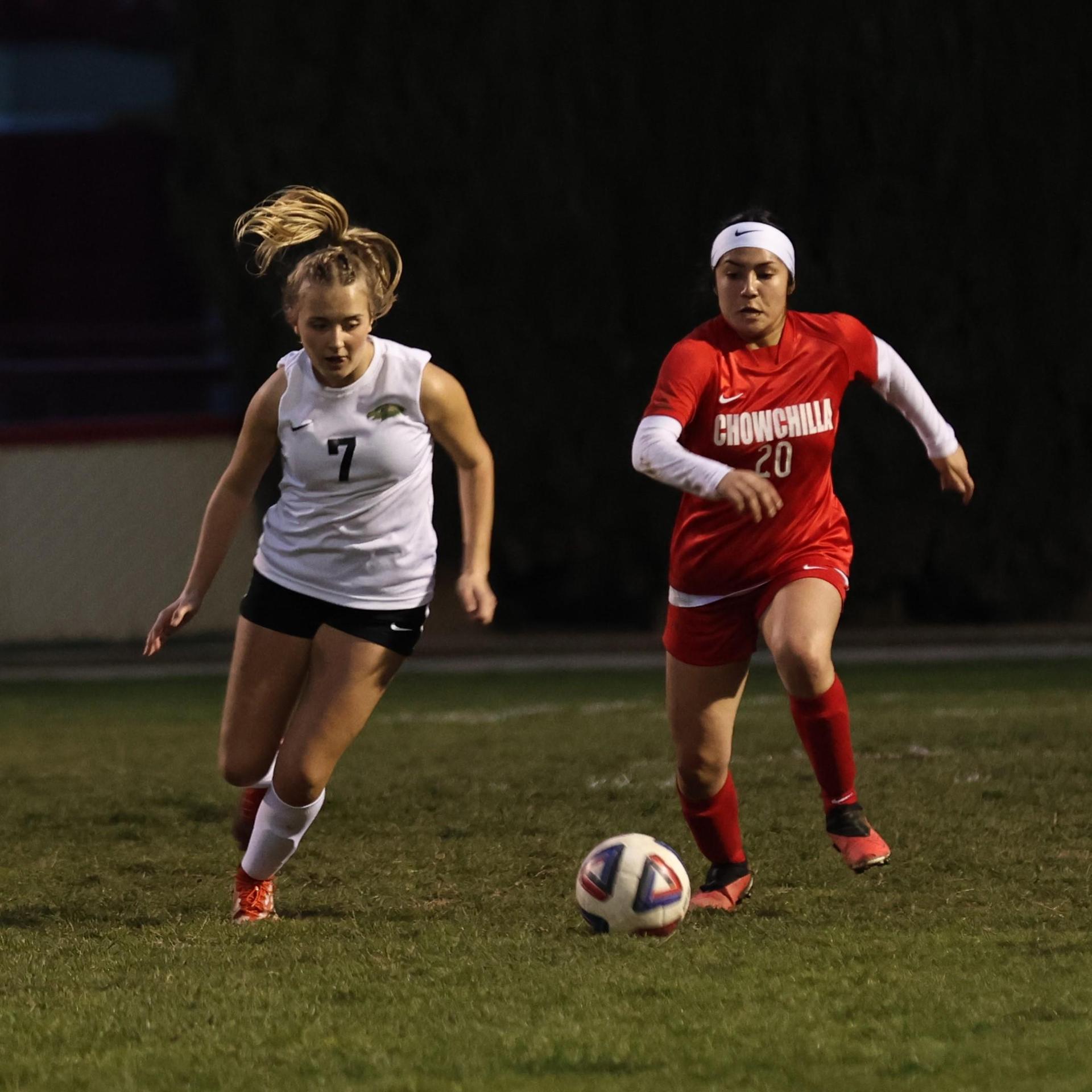 Junior varsity girls playing soccer against liberty