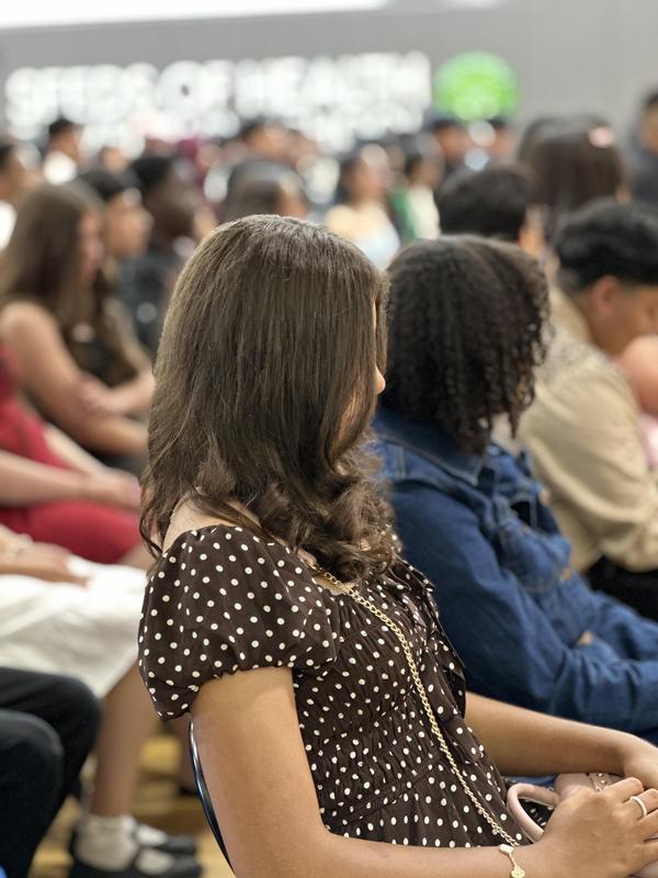 Students sitting at 8th grade graduation ceremony