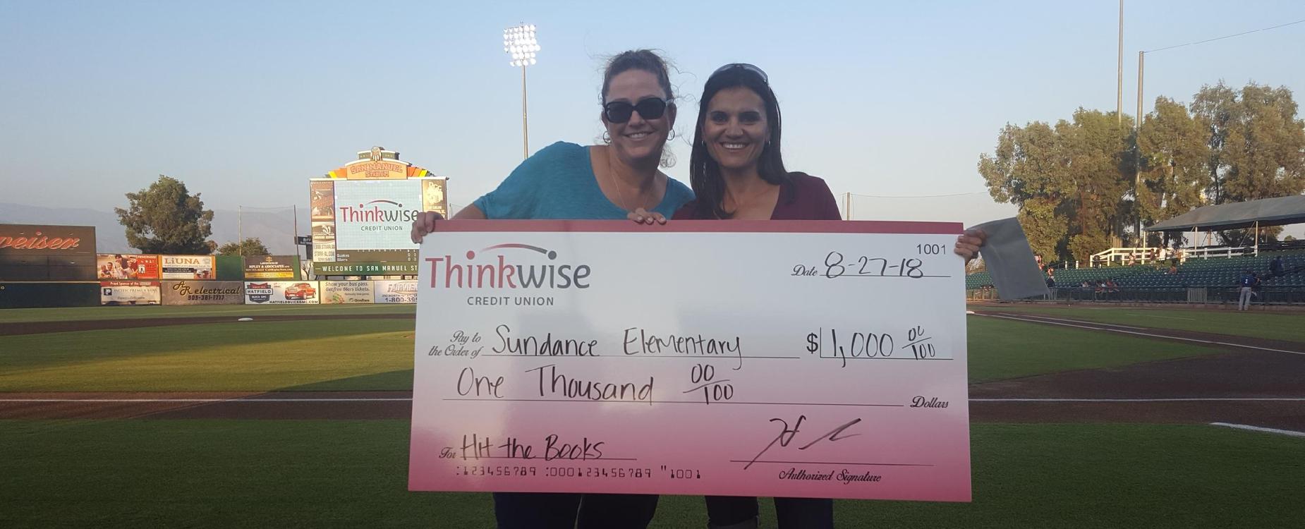 Principal & Clerk receiving our check for winning Hit the Books