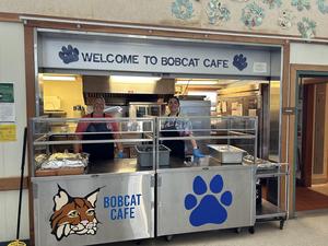 Arcata Elementary cafeteria Food Services staff welcoming students.