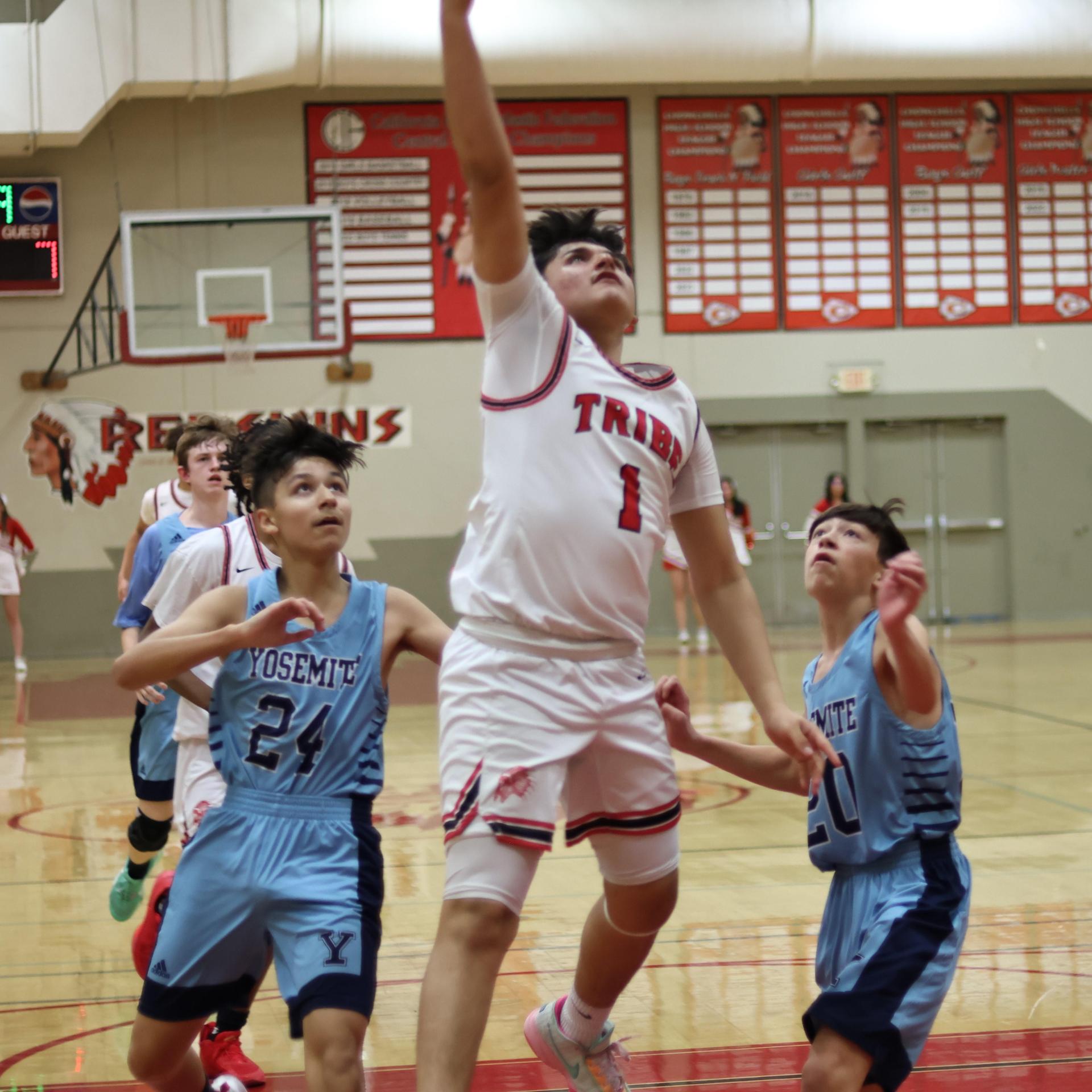 junior varsity boys playing basketball against yosemite