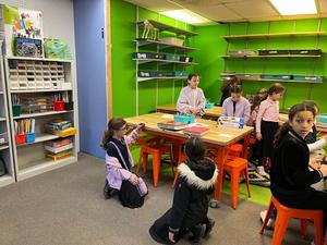 Fourth grade girls test their flying trapeze