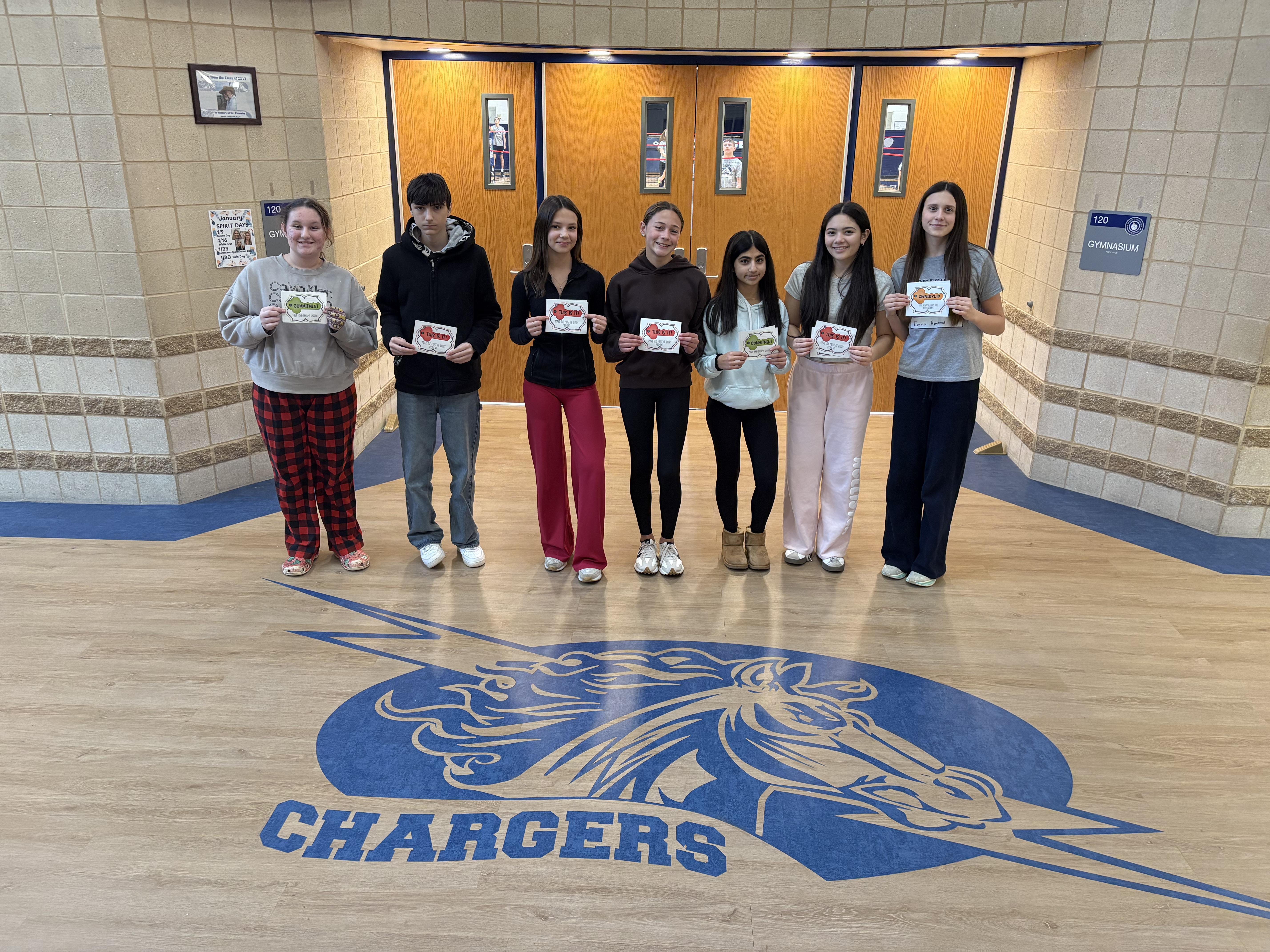 Students holding certificates