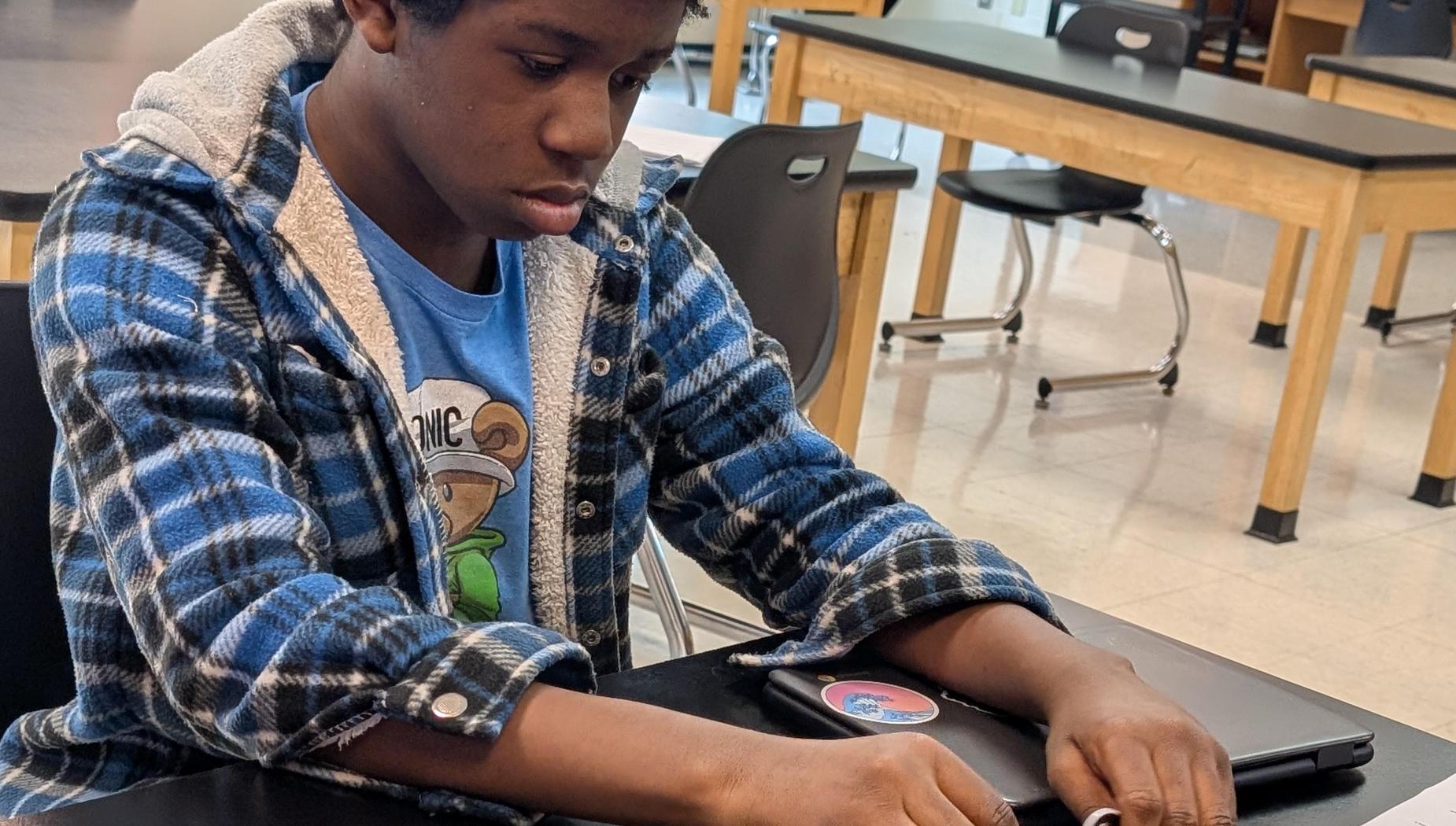 8th grade student making a circuit