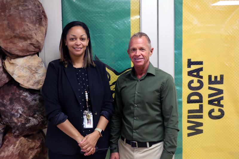 Principal Alexandria Jackson and Assistant Principal Steven Wright stand at the Wildcat Cave,  which is an incentive area created to reward students.