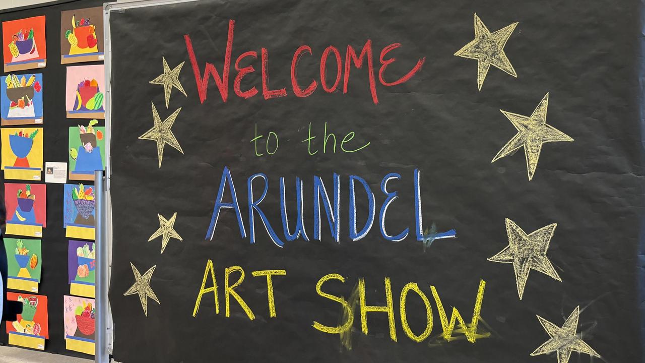 Colorful sign announcing the Arundel Art Show, with star decorations.