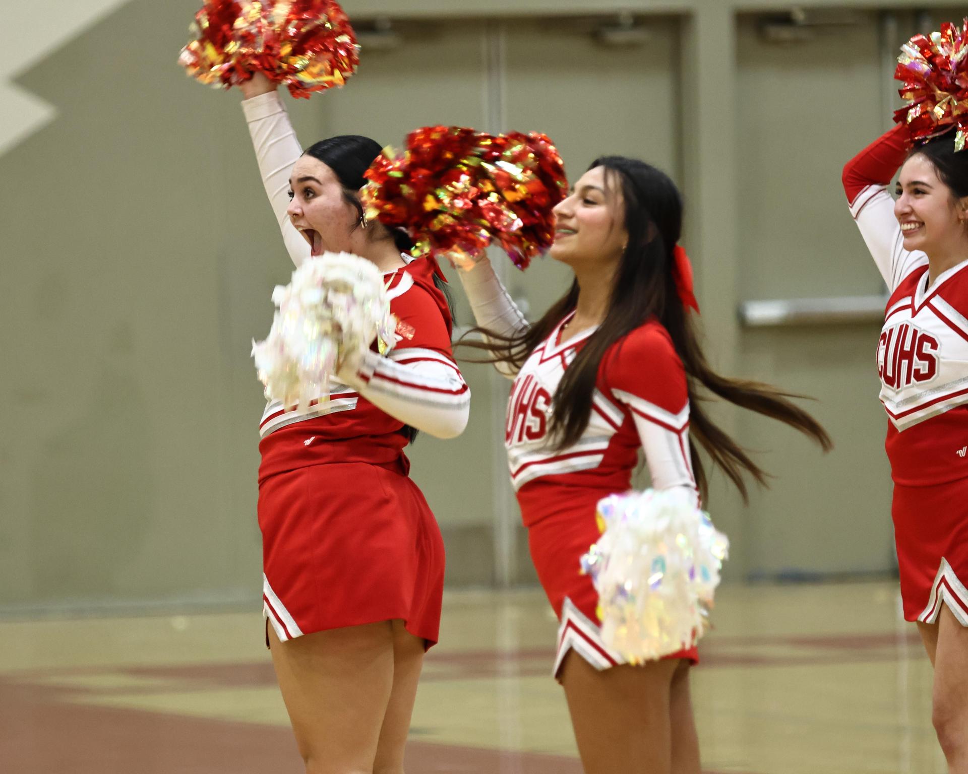 Varsity boys playing basketball against yosemite
