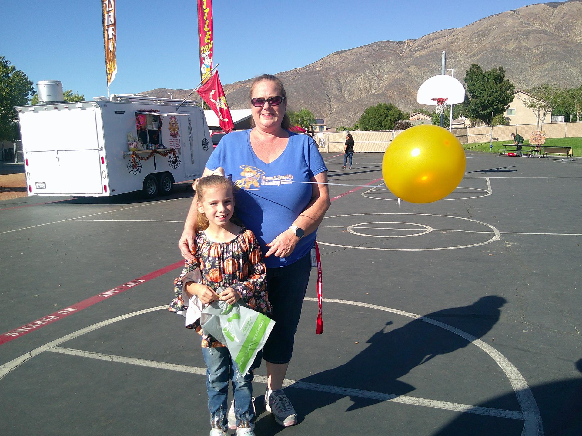 Mrs. Stoh and her daughter at Harvest Festival