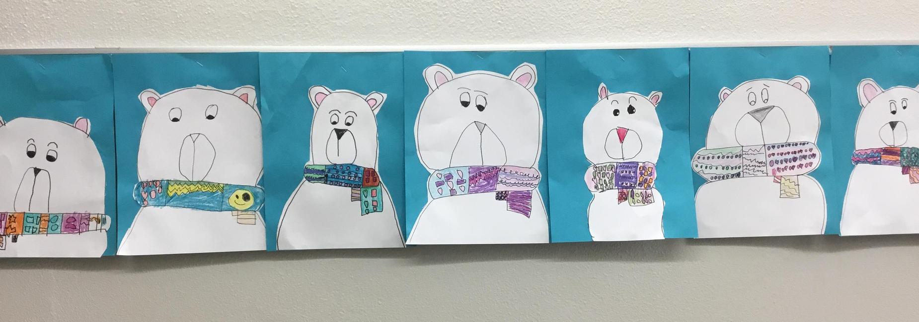 Student drawn polar bears with colorful scarves