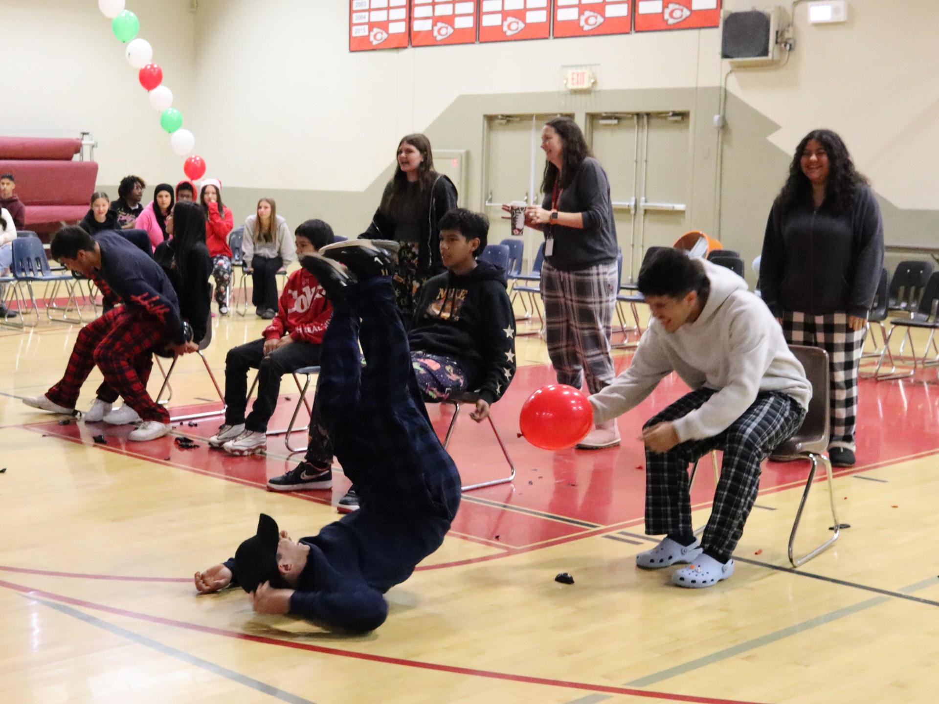 students playing the balloon pop game