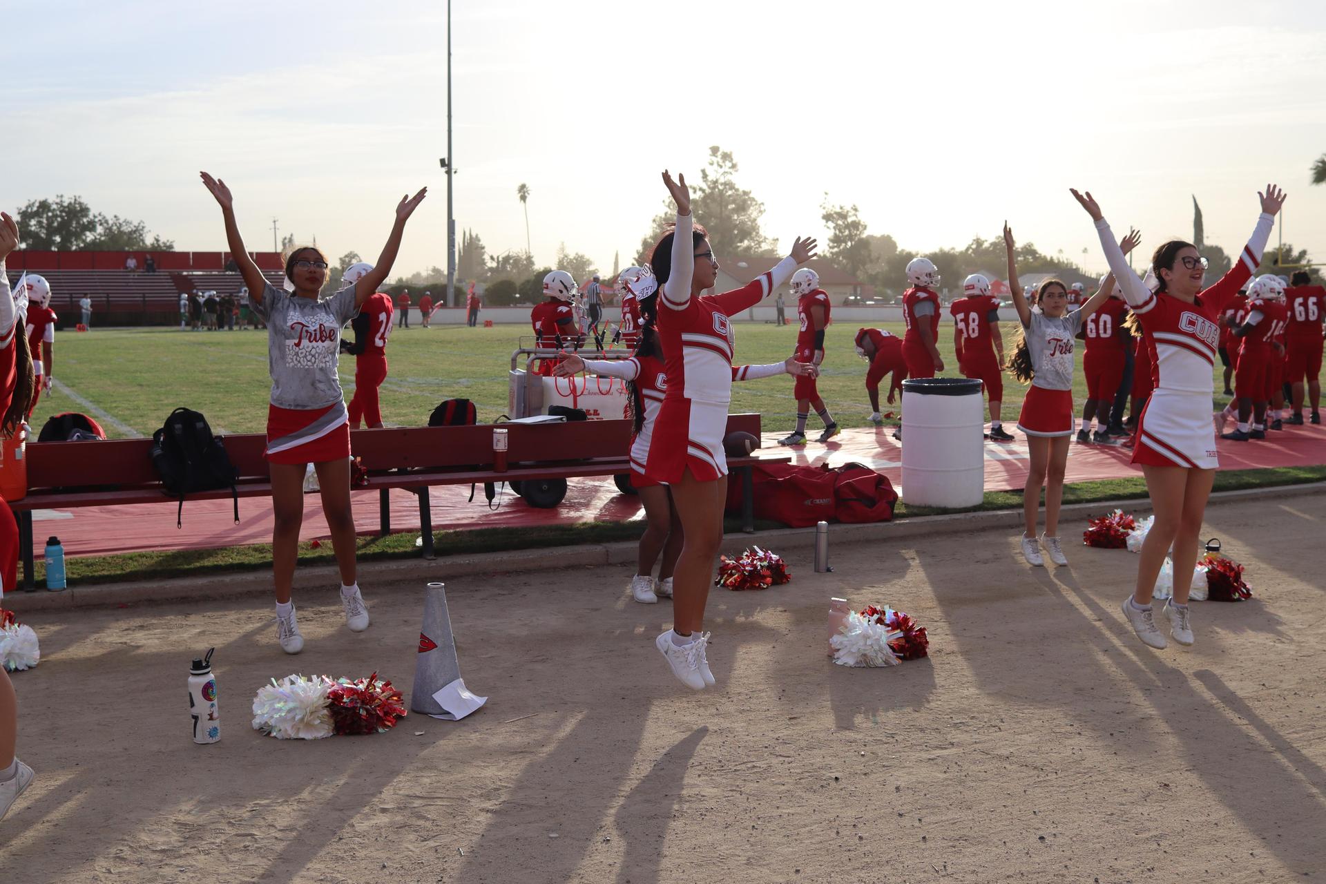 junior varsity cheerleaders in action at the Riverdale game