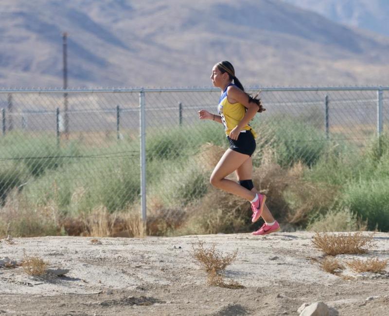Ayana Jaimez-Solorio runs to victory at a home cross country meet.