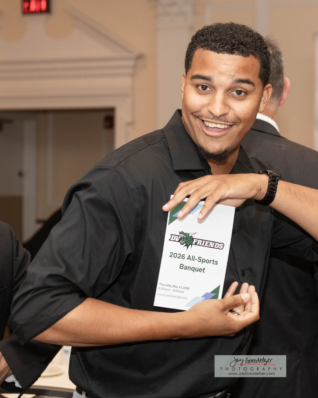Coach Holding Event Brochure