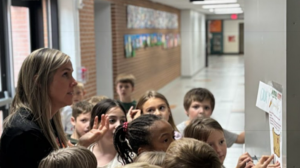 Principal Jewett leads students on a scavenger hunt.