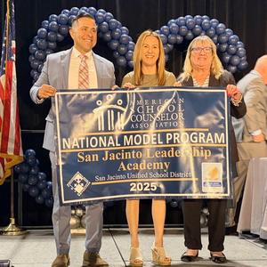 Principal and SJLA Counselors with RAMP award banner