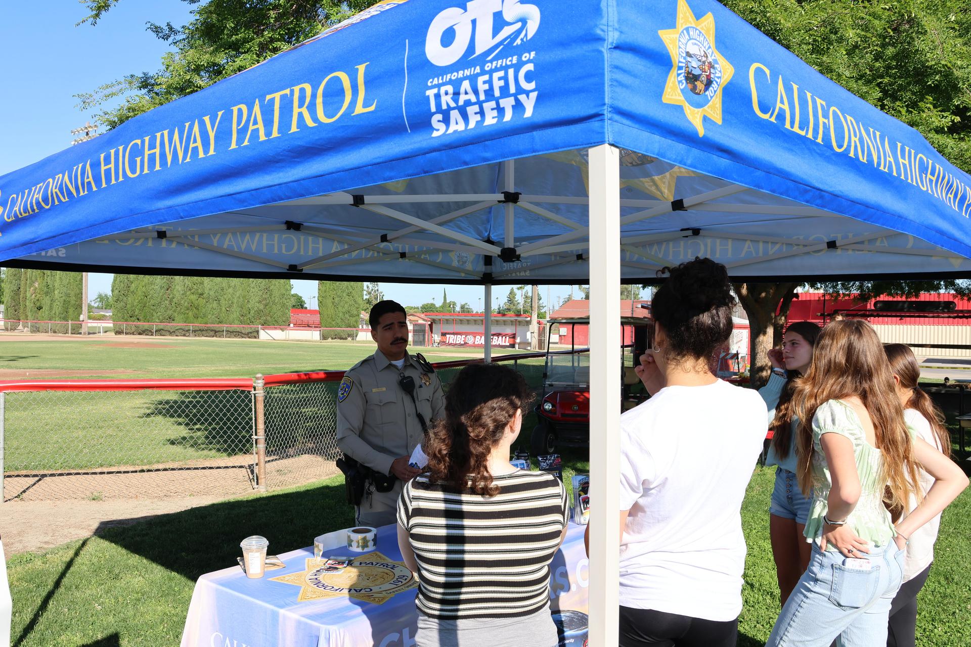 Highway patrol officers speaking to students